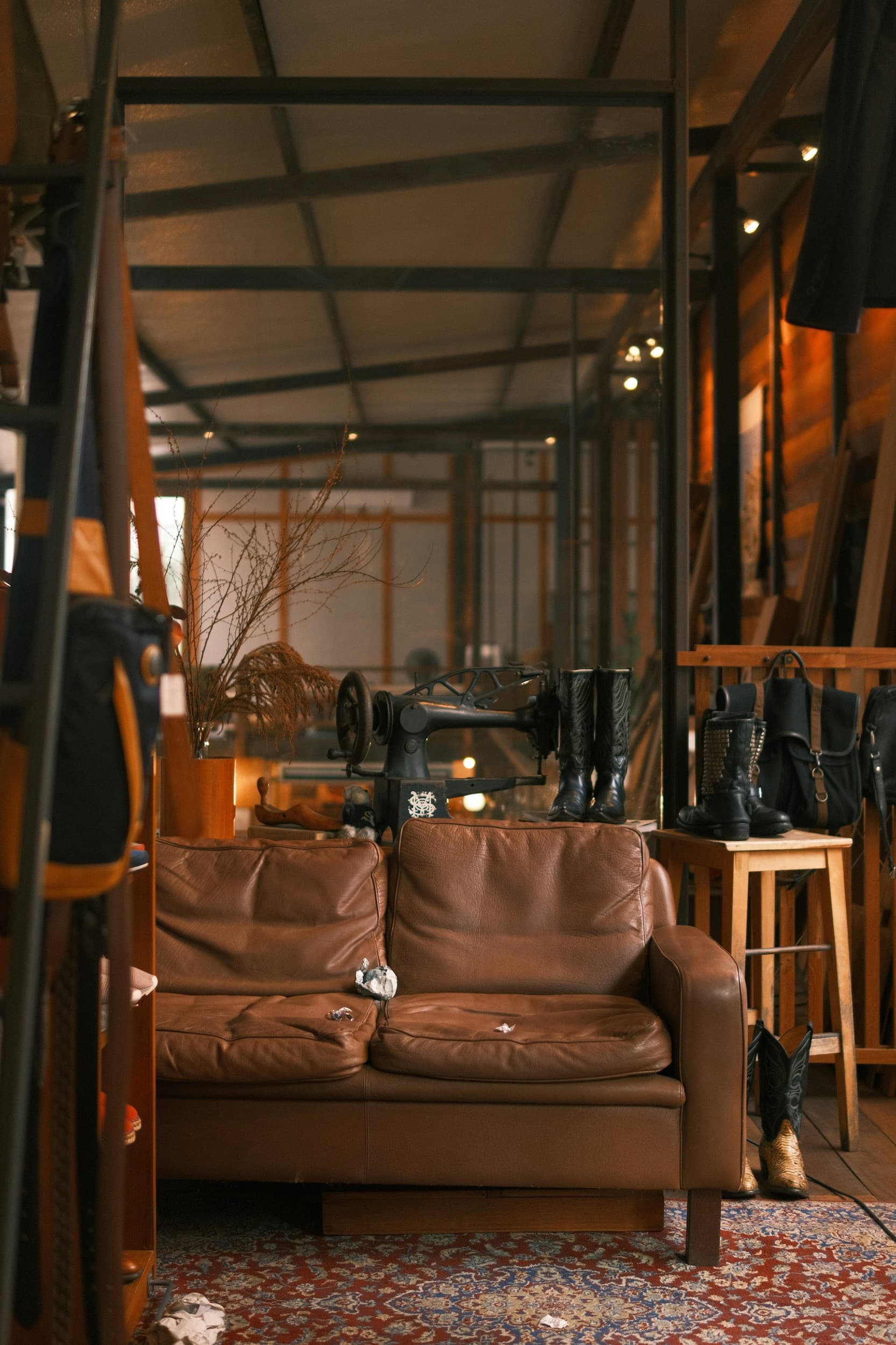 A leather sofa and vintage sewing machine in the Salgo workshop